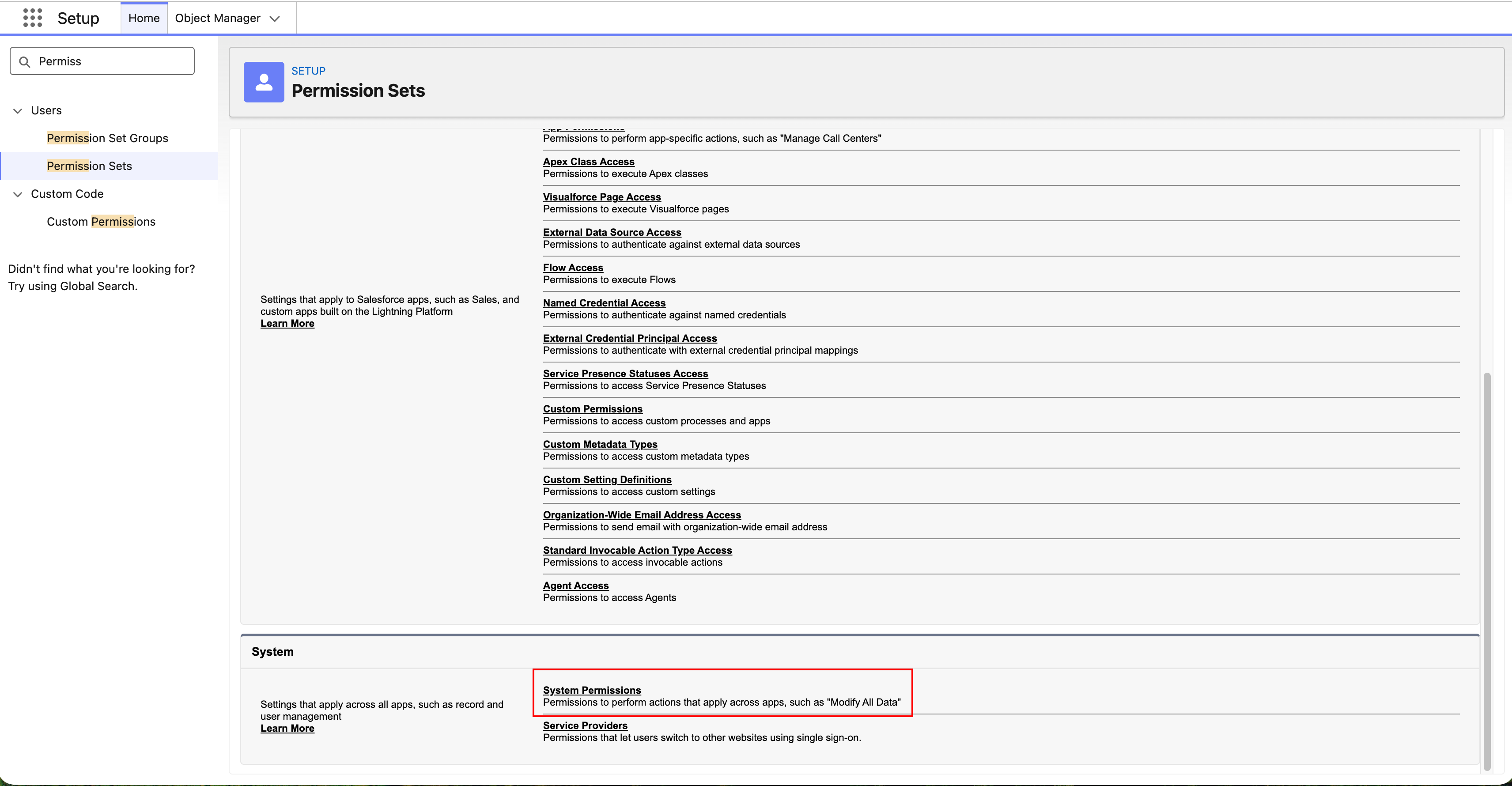 Salesforce Setup screen showing the Permission Sets page. The System Permissions section is highlighted, listing permissions that apply across apps, such as Modify All Data. Permission Sets is selected in the left navigation.